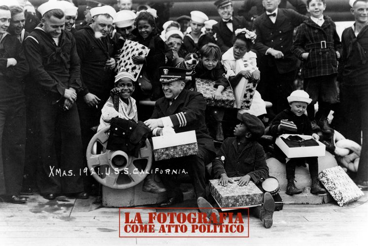 Christmas party for disadvantaged children, held on board the battleship by her crew, at San Pedro, California, December 1921.  Collection of Rear Admiral B.F. Hutchison. Courtesy of Mrs. Worth Sprunt, 1974.  U.S. Naval History and Heritage Command Photograph.